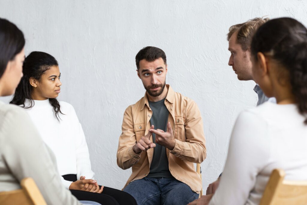man-explaining-his-problems-group-therapy-session
